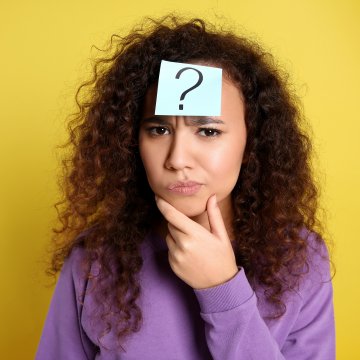 advanced system repair pro system optimizer woman with long curly hair wondering yellow background